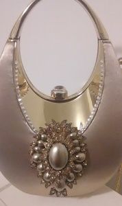 A gold  colored satin pocketbook